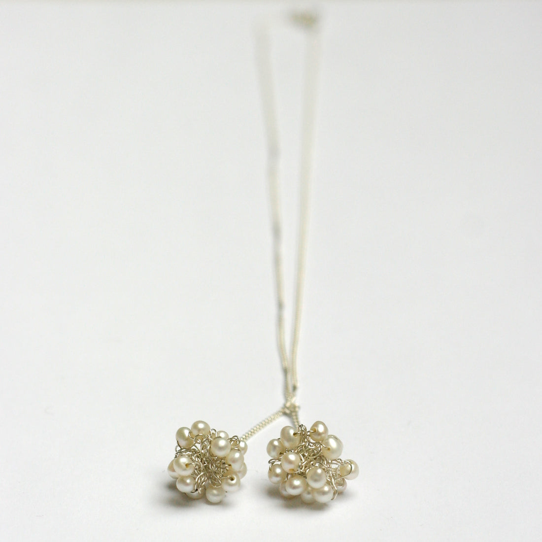 ketting witte pareltjes 2 bolletjes