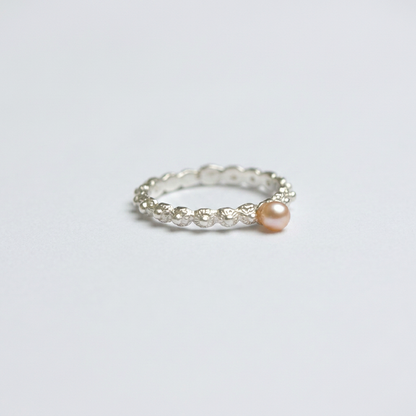 Unique silver sliding ring with pink pearl | Zeeland knot